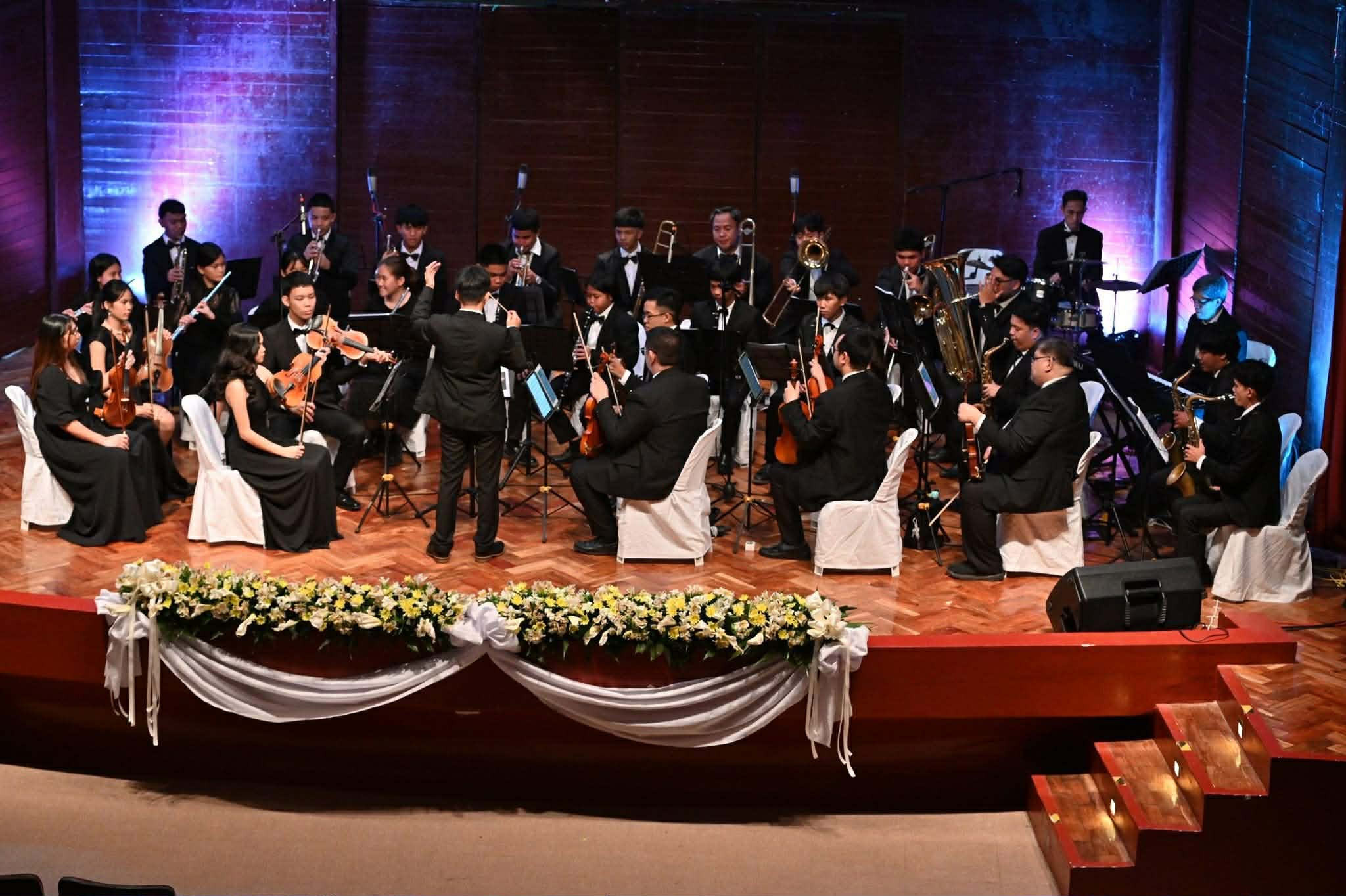 Full orchestra performing on stage