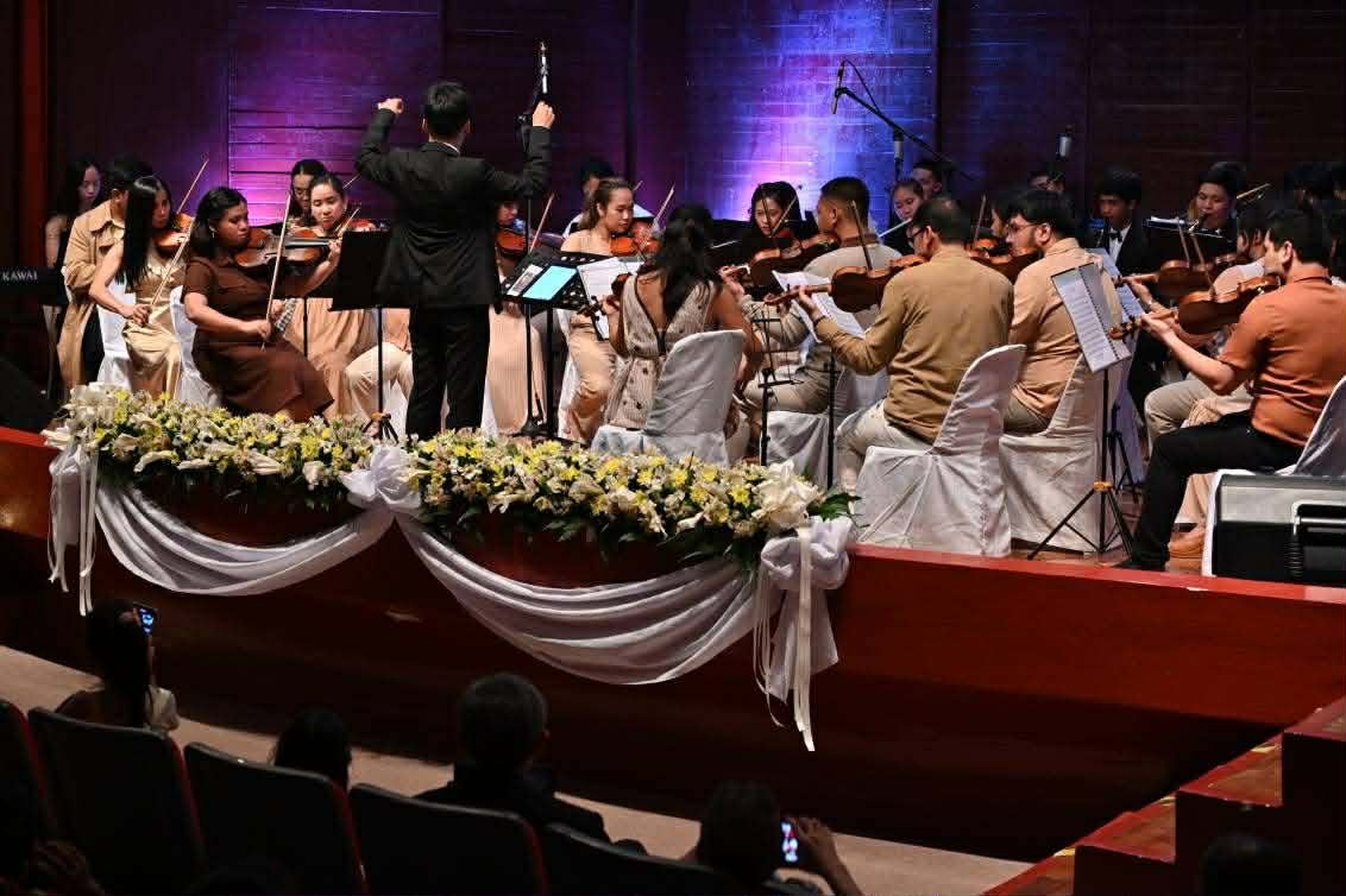 Conductor leading the orchestra